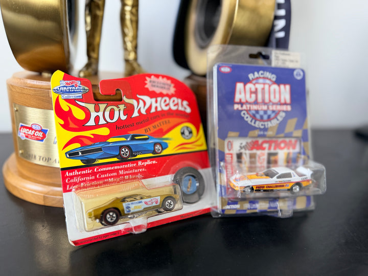 Don “The Snake” Prudhomme Funny Car Snake 2-Pack – Plymouth Cuda & 1983 Pepsi Challenger (1:64 Scale)